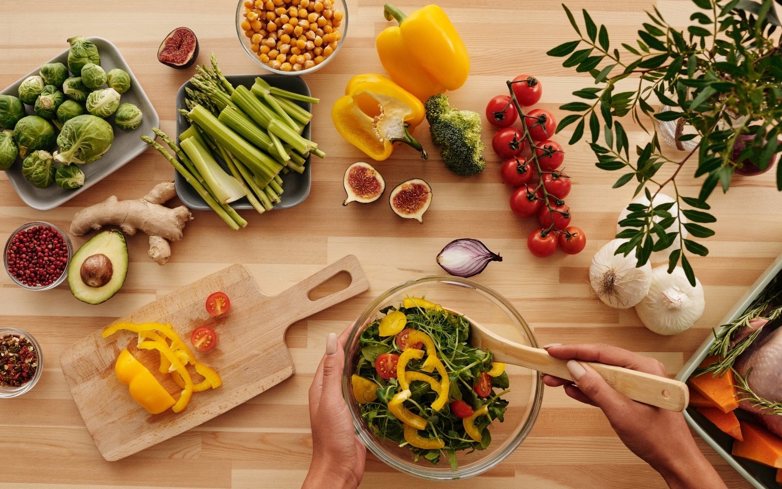 Person preparing vegetable salad