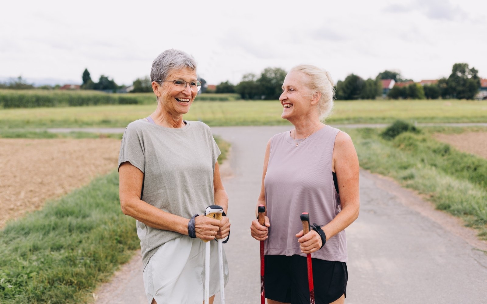 Two active older women smiling